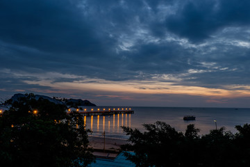 Beautiful illuminated shining in twilight at Prachuap port