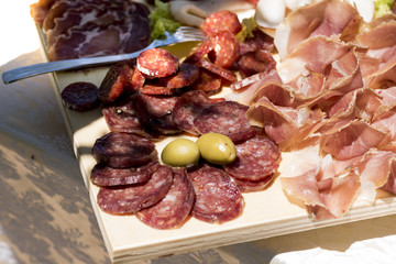 reach of the kitchen of typical Italian cold cuts, pork: salciccia , prosciutto , salami