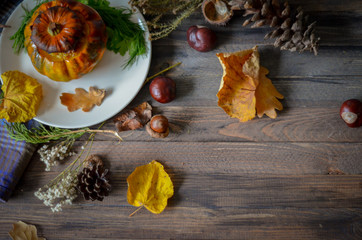 Pumpkin baked with meat on wooden background