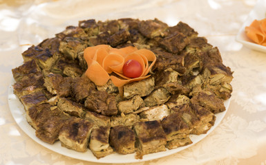 small taste of frittata with artichokes served on white plate
