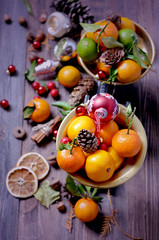 Obraz na płótnie Canvas Vintage decorative Christmas fruits tangerines