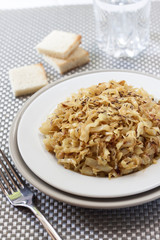 Fried cabbage with caraway and garlic on a plate