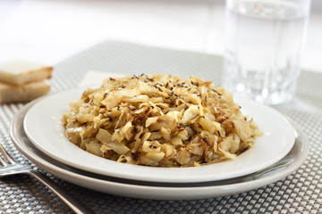 Fried cabbage with caraway and garlic on a plate