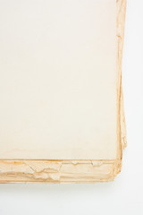 An old book with a crumpled sheet