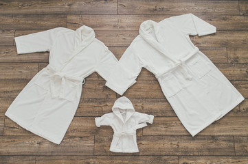 Three white Bathrobe