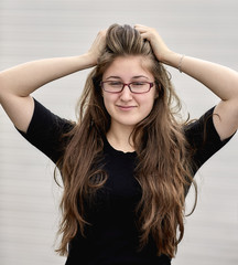 Young Adult Woman with Long Hair Grinning