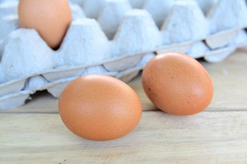 Chicken eggs on a wooden table