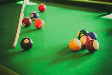 Snooker ball and stick on billiard table