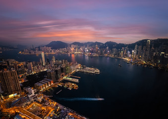 Evening aerial view panorama of Hong Kong skyline and Victoria Harbor. Travel destinations