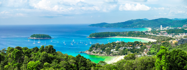 Tropical beach landscape panorama. Beautiful turquoise ocean waives with boats and sandy coastline...
