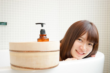 Young woman relaxing in a bathroom