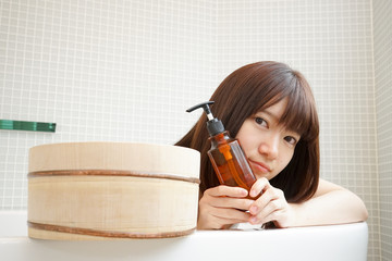 Young woman relaxing in a bathroom