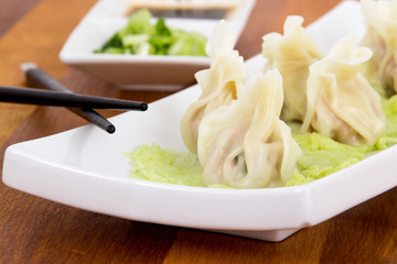 Steamed pork dumplings on plate closeup
