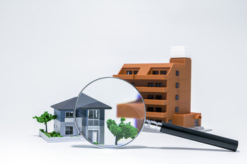 house, apartment building and magnifying glass, searching or checking concept