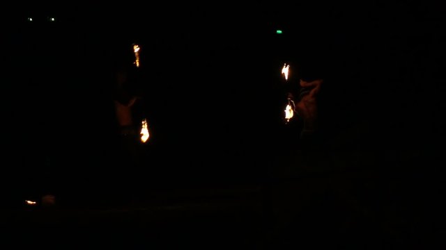Men playing with fire during show at night, super slow motion 240fps 
