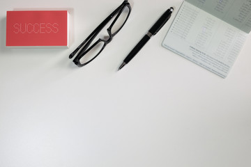 White office desk table with a note book and  notebank, with cop