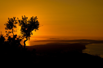 Fototapeta na wymiar view of the sunset over an archipelago of islands in croatia during summer , Losinj Island