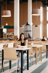shot of a beautiful woman drinking coffee in cafe