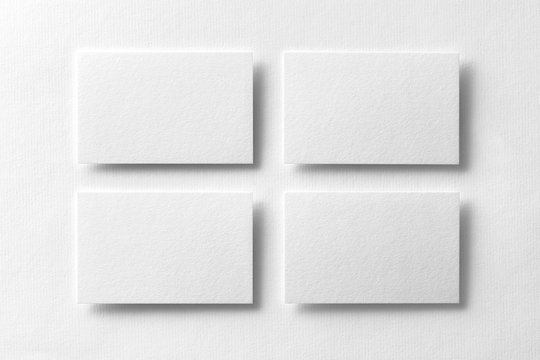 Mockup of four white business cards arranged in rows