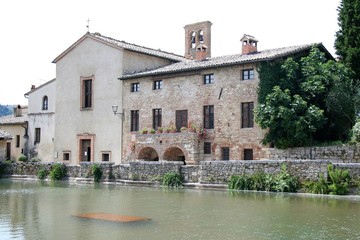Fototapeta premium the square of Bagno Vignoni, built around a fountain of hot thermal water 