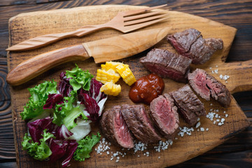Closeup of medium rare cooked machete beefsteak, high angle view