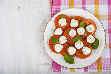 Caprese salad on a wooden table