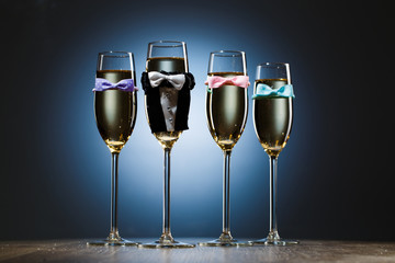 Four elegant stylish champagne glasses. Bachelor party concept