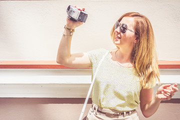 Girl posing with a camcorder