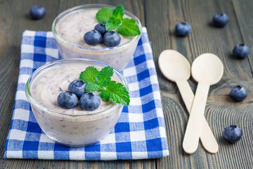 Cream cheese and blueberry mousse in glass, horizontal