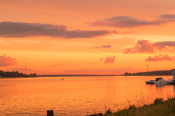 Fototapeta na wymiar good orange sunset over river