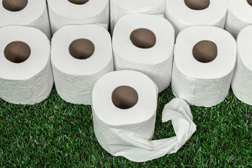 White toilet paper on green grass