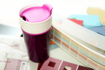 Purple cup with palette in the office of modern designer