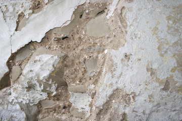 Crumbling concrete stone wall