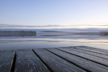 Fototapeta na wymiar Empty pier on a foggy evening.