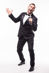 The Showman interviewer with emotions. Young elegant man holding microphone against white background.Showman concept.