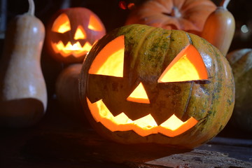 two halloween pumpkins jack faces with moonlight on top