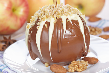 Apples in chocolate with nuts