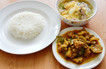 rice eat with spicy stir fried wild boar curry and egg  soup