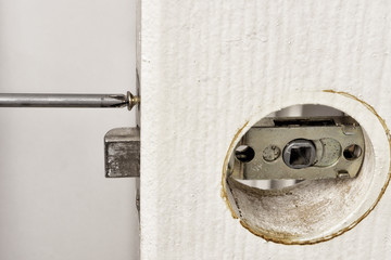 Install latch with a screwdriver on the door.