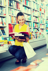 Woman looking at book © JackF