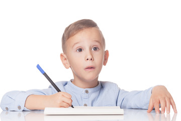 Amazed boy with pen