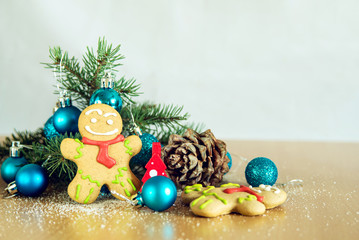 gingerbread man near Christmas tree with toys