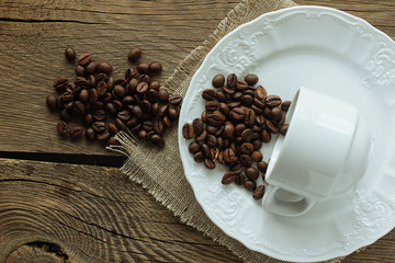 Coffee beans, cup and plate top view