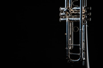 Fototapeta premium trumpet, wind instrument / lonely musical instrument which is a trumpet on a black background 