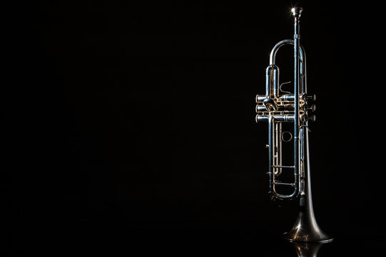 trumpet, wind instrument / lonely musical instrument which is a trumpet on a black background
