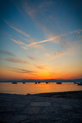 Obraz premium Lacise - Lago di Garda 9 - Sunset at the lake