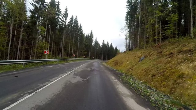 2K. Driving on a mountain rural road. Point of view camera filming.