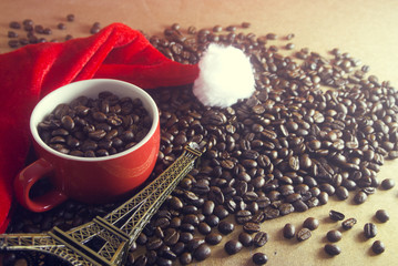 coffee in the cup with eiffel tower and santa claus hat