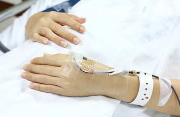 A woman getting a transfusion as a blood donor