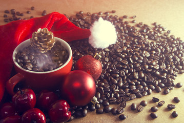 coffee in the cup with pine cone and decor ball and santa claus hat